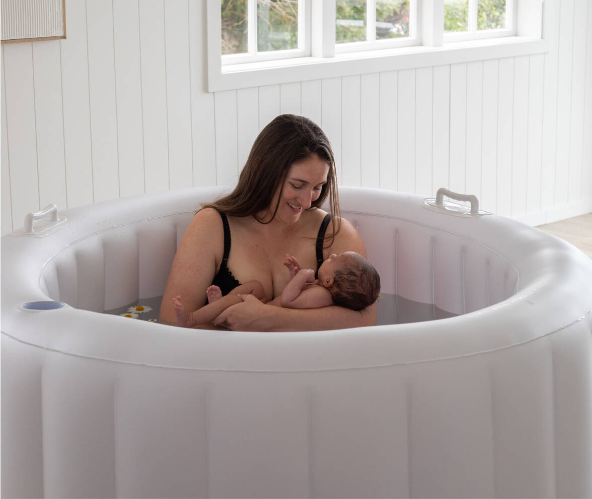 Bloom Birth Pools - main close up of woman with child in birth pool